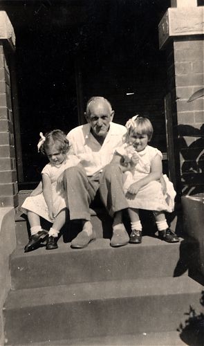 Poppa and his grand-daughters in their Sunday best